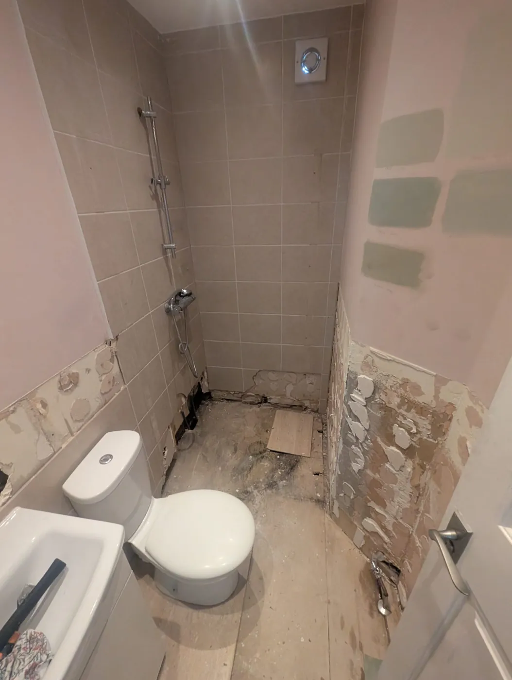 Lille Road strip-out with the old shower valve and tiles still in place