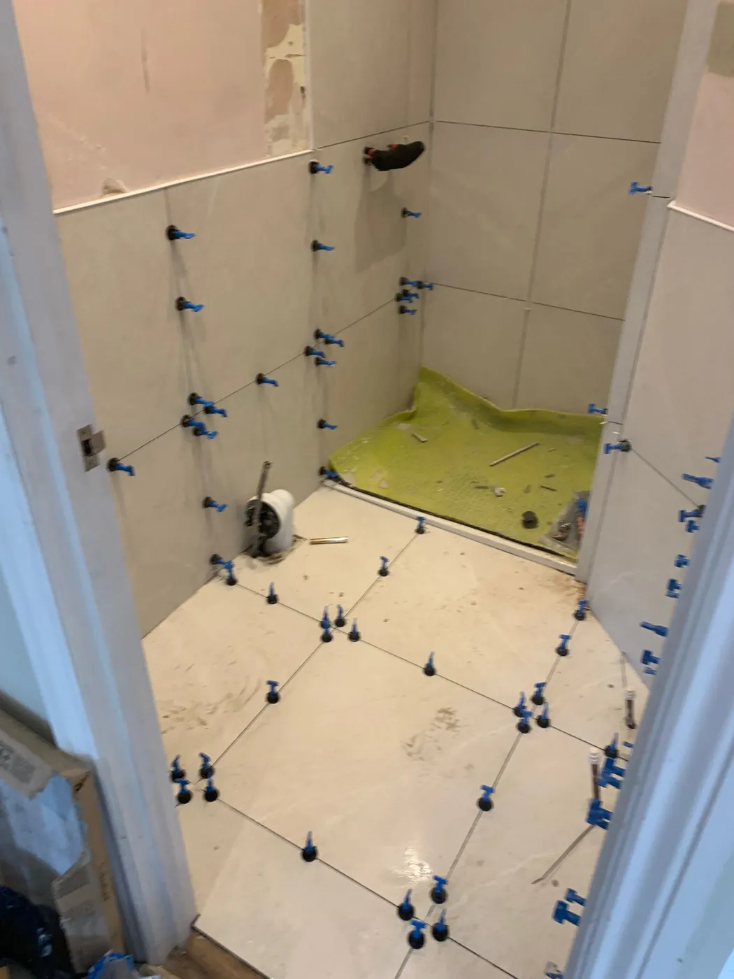 Lille Road large-format porcelain tiles being laid with a levelling system