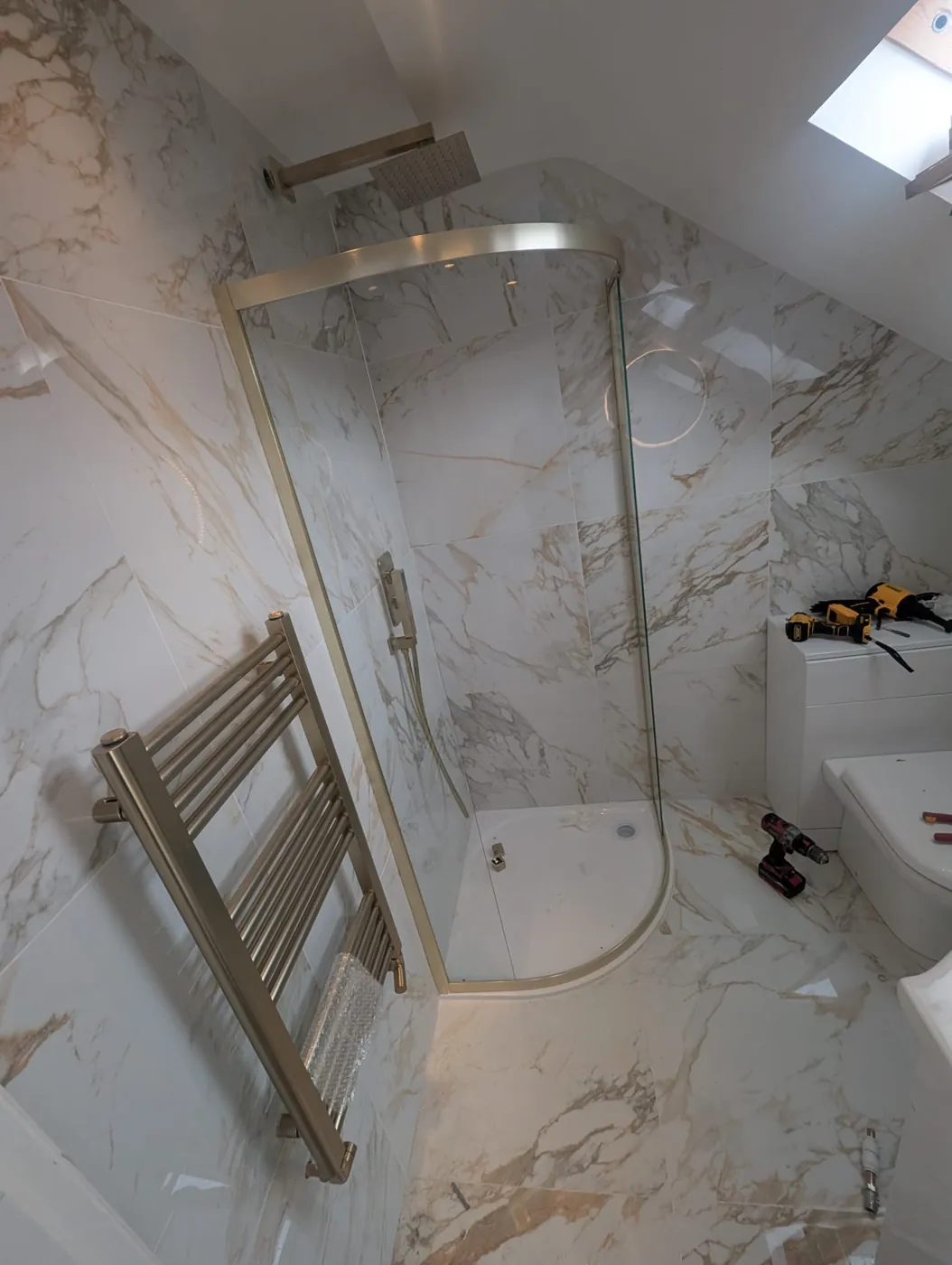 Brushed-brass quadrant shower enclosure and rain shower at Rosaline Road