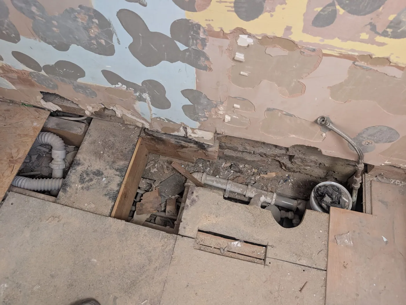 Rosaline Road floor opened up exposing old waste pipes and the floor structure