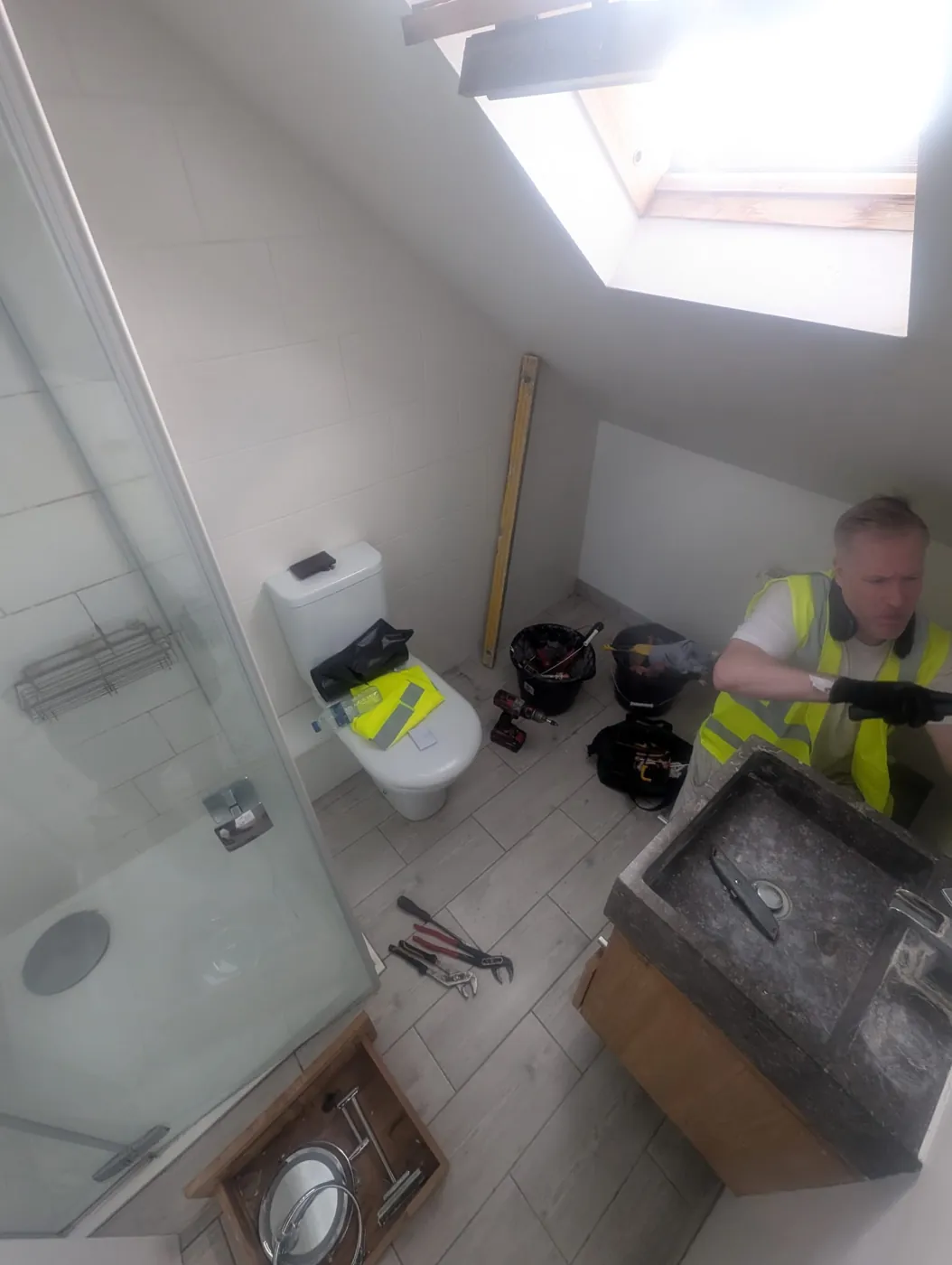 Our installer at work in the original Rosaline Road en-suite before the strip-out